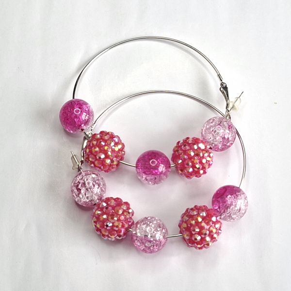 Aretes con esferas rosadas 